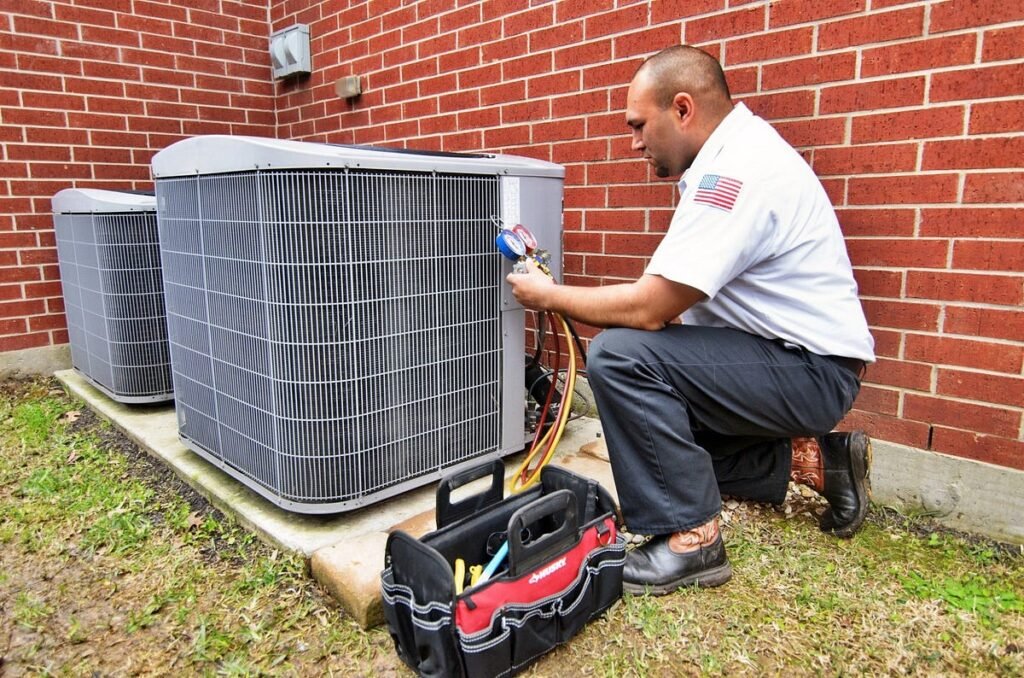 Technician repairing an outdoor air conditioning unit