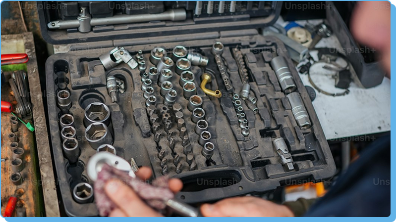 Mechanic cleaning tools in a toolbox