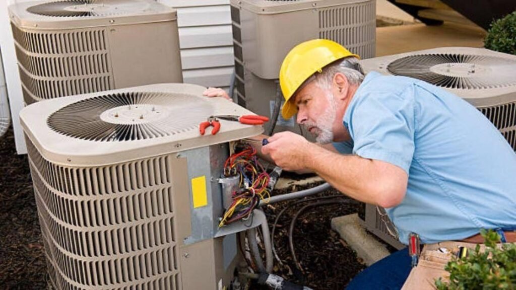 An air conditioning technician repairing a unit