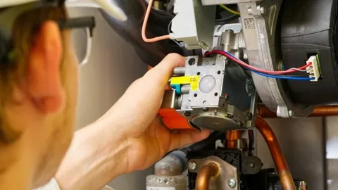 The technician is working on a heating system