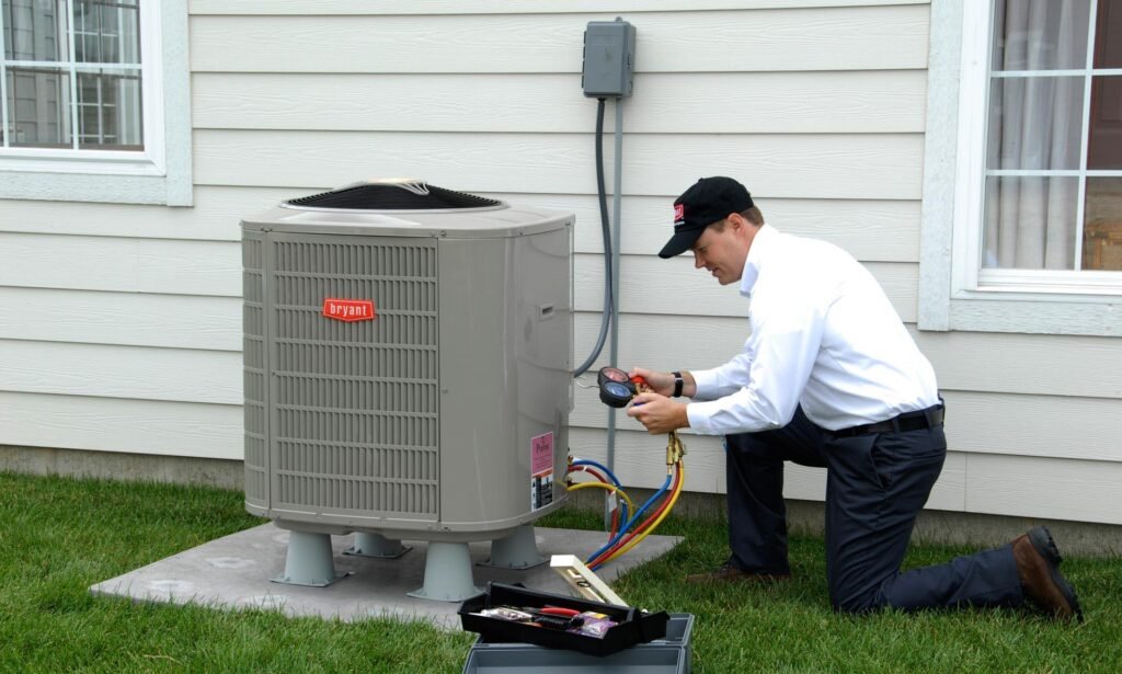 Technician servicing an outdoor Bryant air conditioning unit