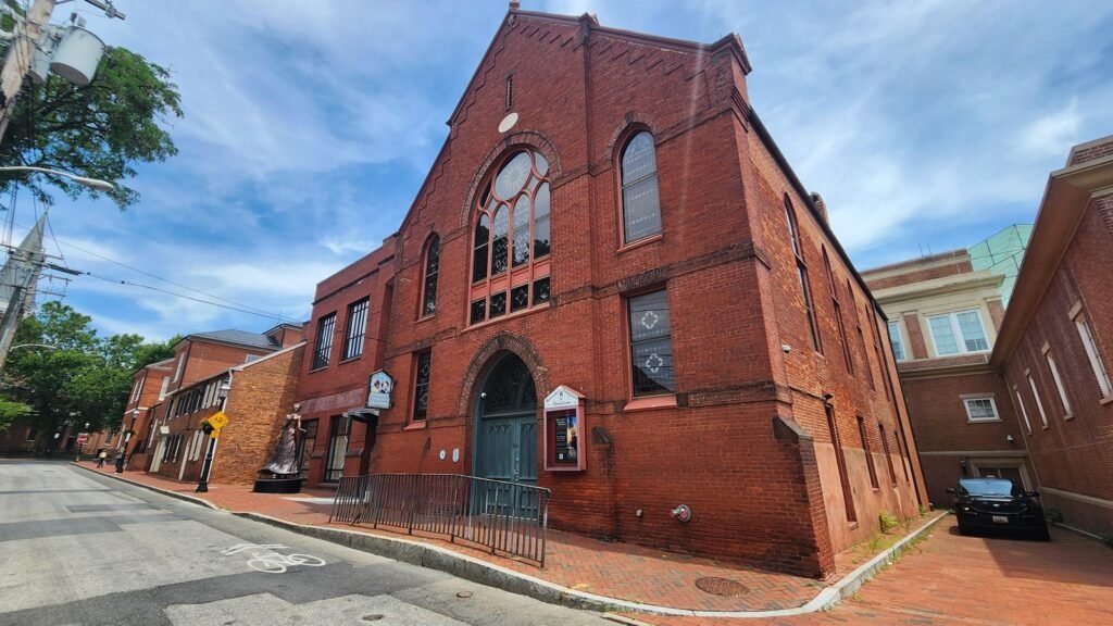 Historic red brick building with arched windows